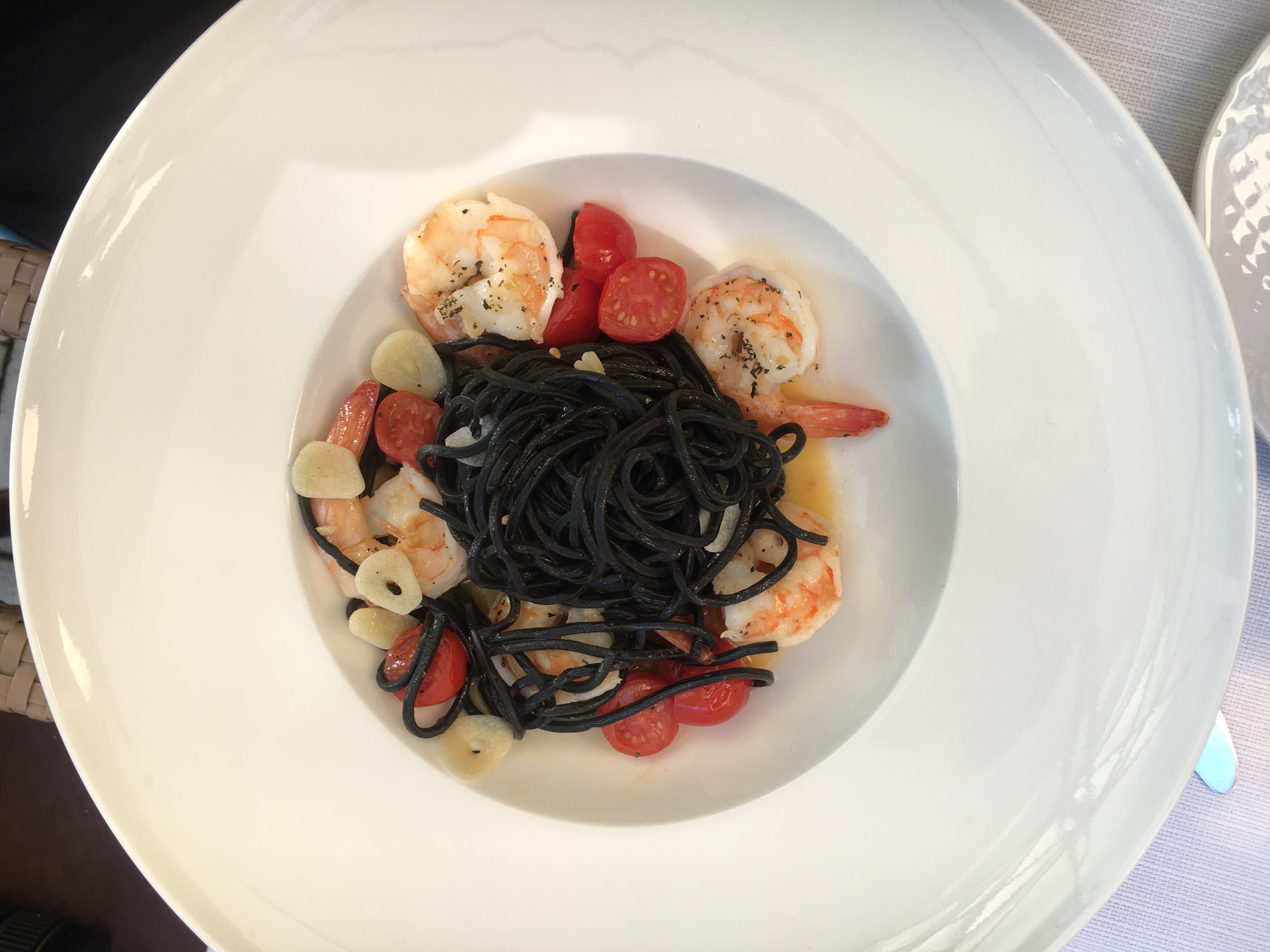 ink pasta with shrimps, tomatoes and garlic